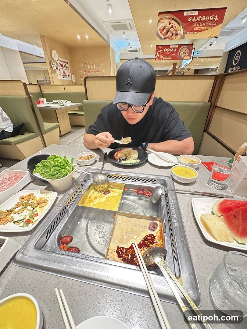 Person dining at a hot pot restaurant