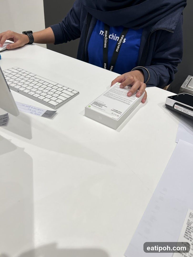 Staff at counter with product box