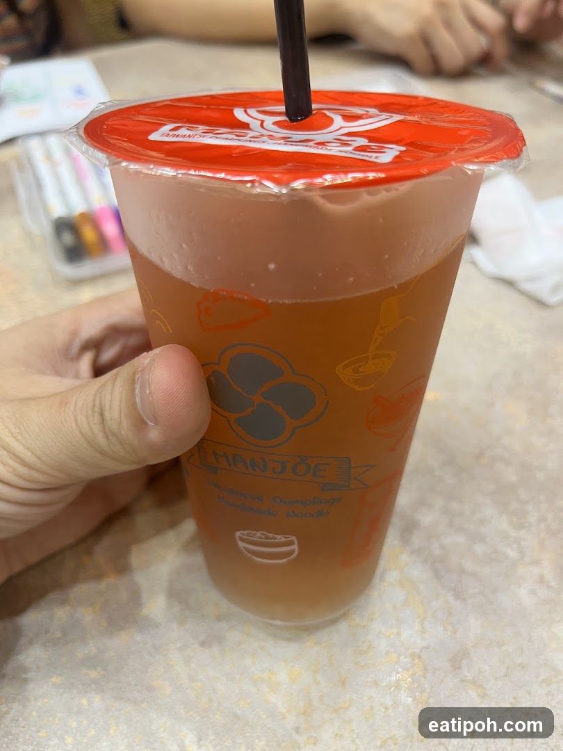 Hand holding a beverage cup
