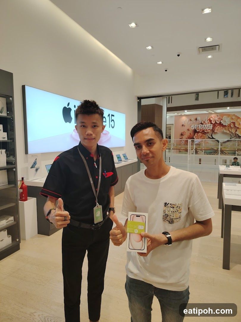 Two individuals in Apple store interior