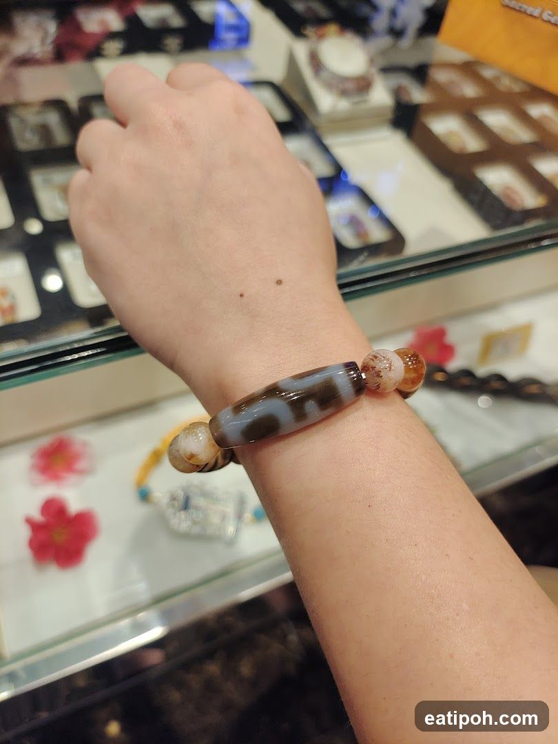 Hand wearing bracelet in jewelry store