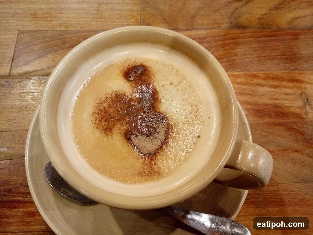 Coffee in ceramic cup on wooden table