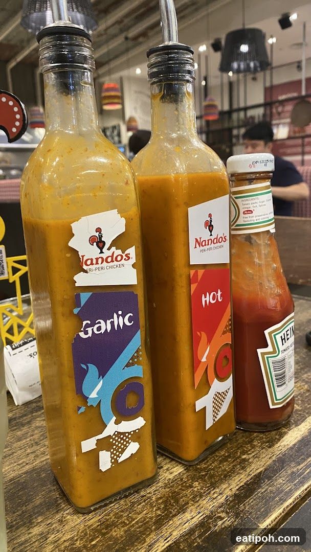Nando's Sauce Bottles on Counter