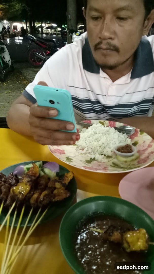 Man at outdoor dining table