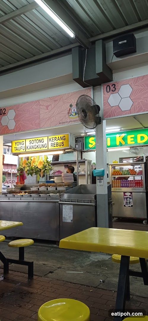 Food stall interior with yellow seating