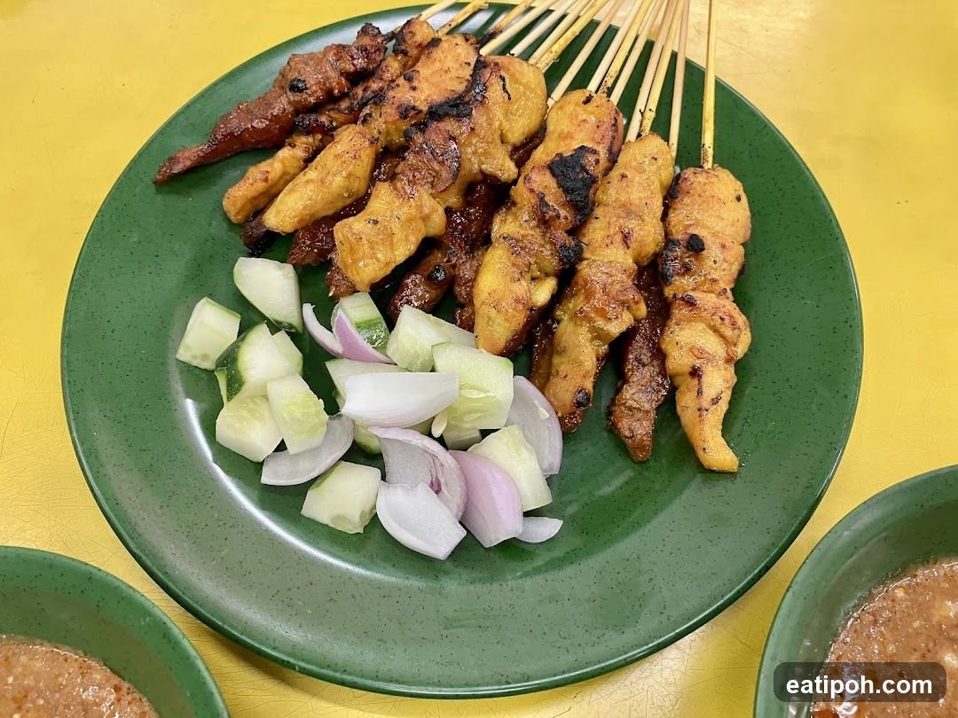 Grilled skewers with vegetables on green plate