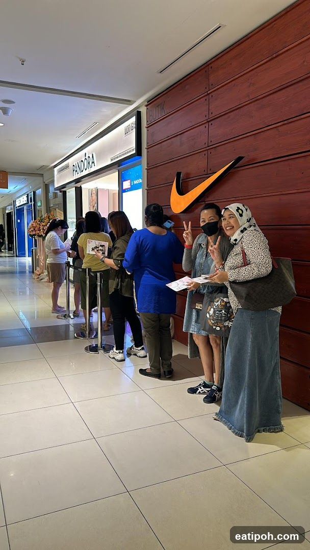 Shoppers in shopping mall corridor