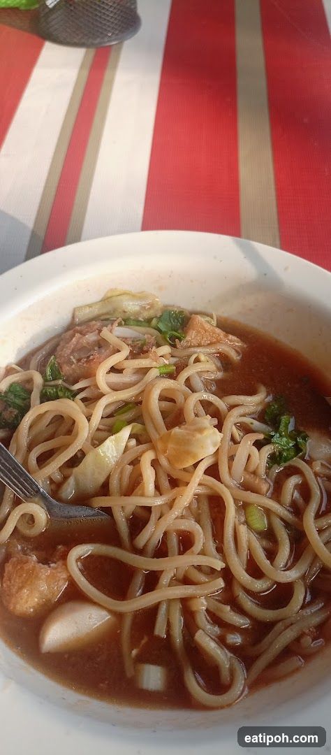 Noodle Dish on Red and White Striped Tablecloth