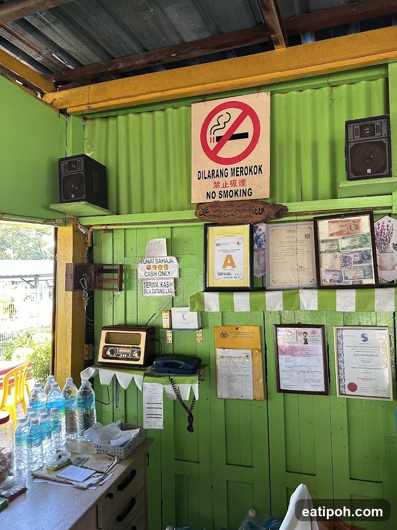 Interior of a small establishment with green walls