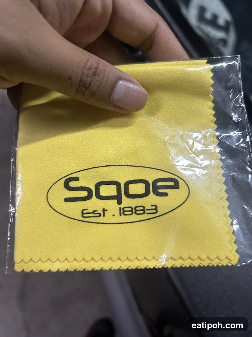 Hand holding Sqoe cloth