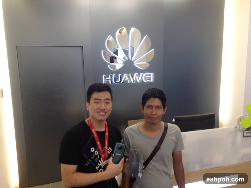 Two individuals at Huawei store