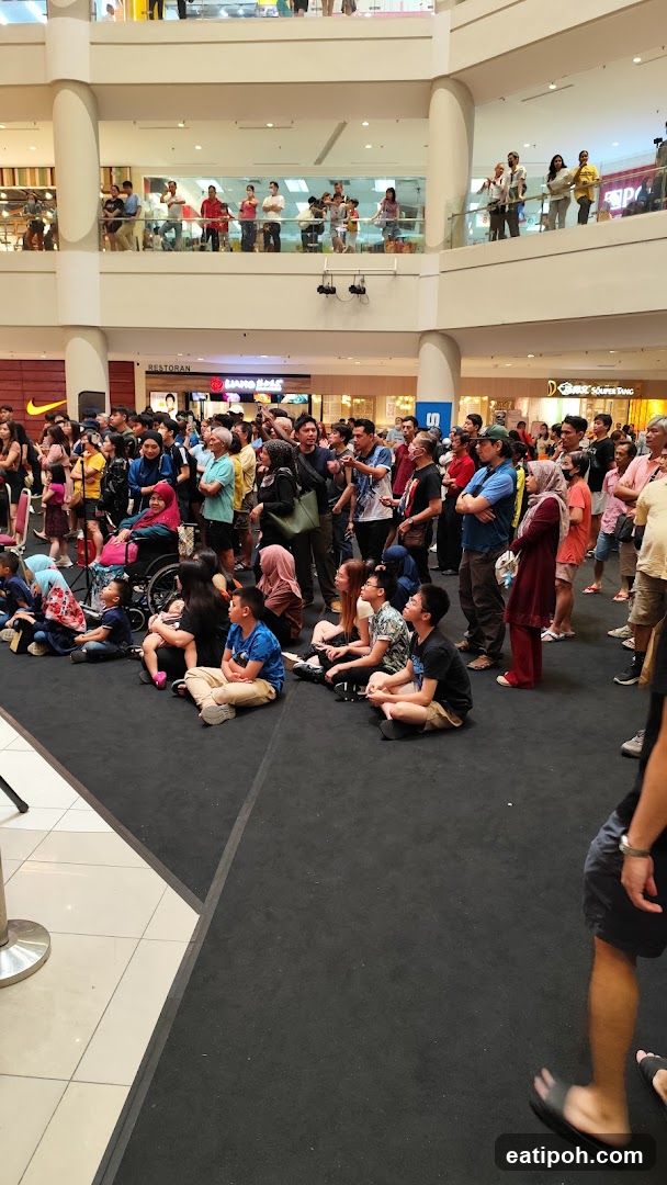 Crowd Gathering in Mall Interior