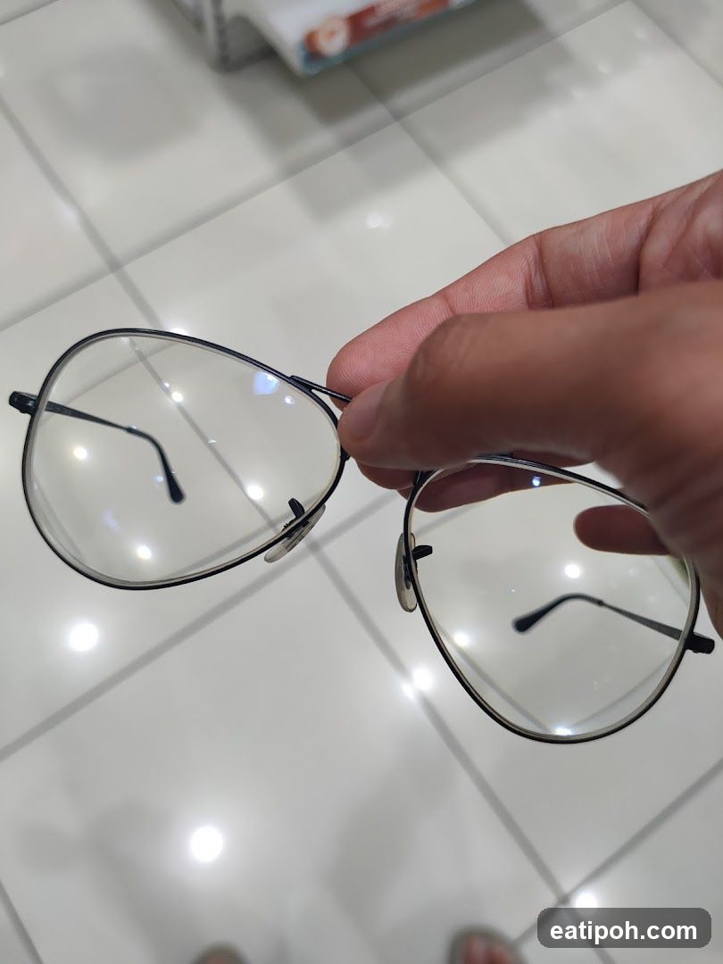 Hand holding glasses