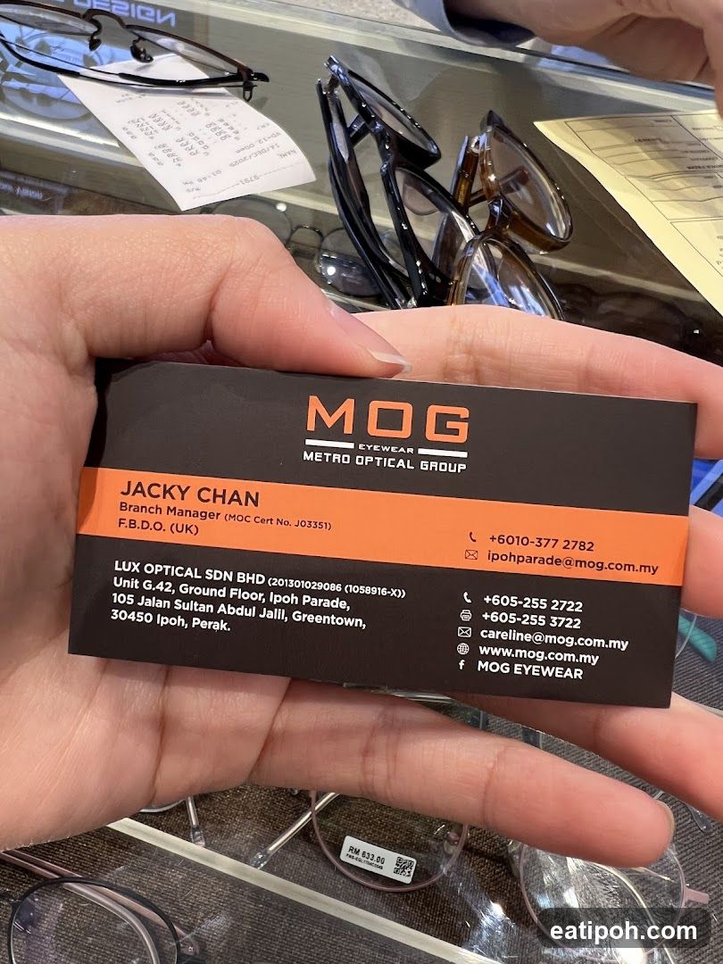 Business Card Held in Hand