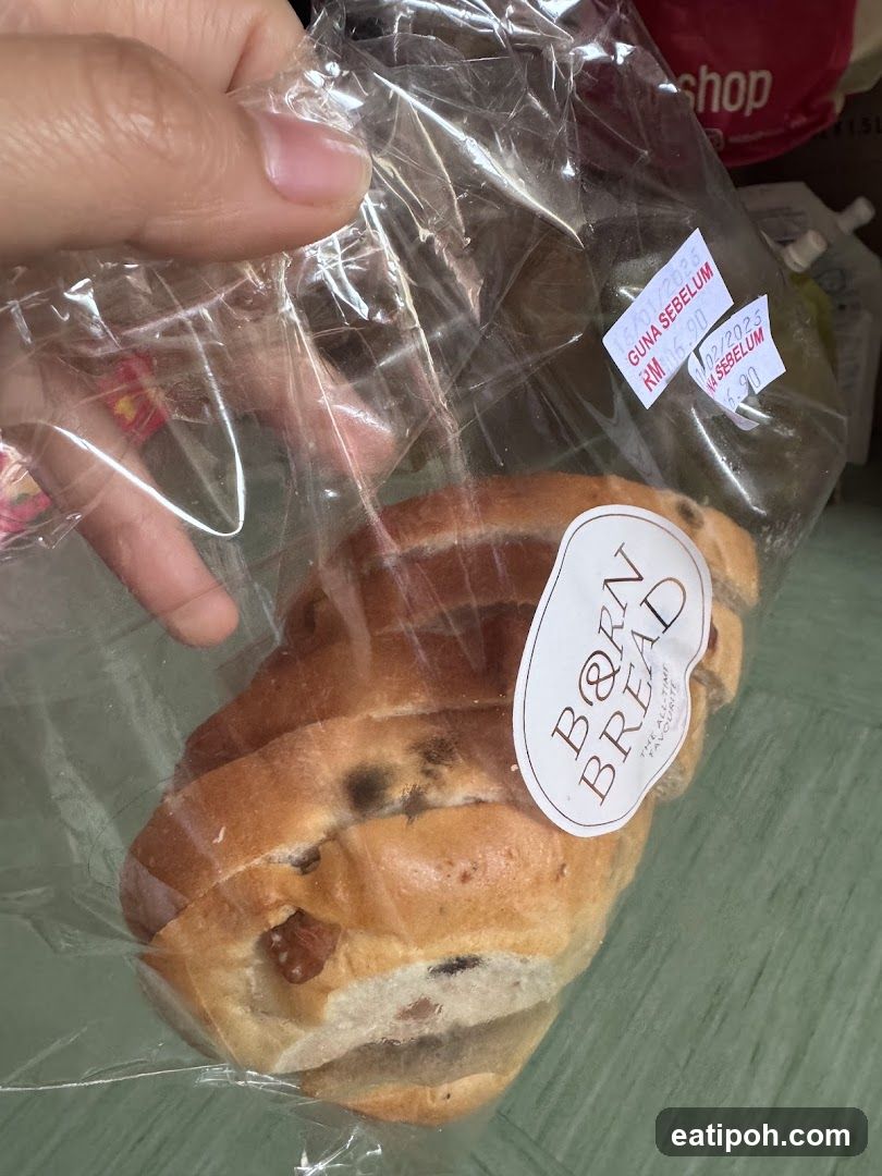 Hand holding packaged bread