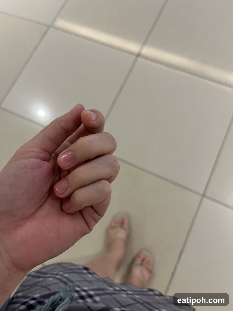 Hand and Foot on Tile Floor