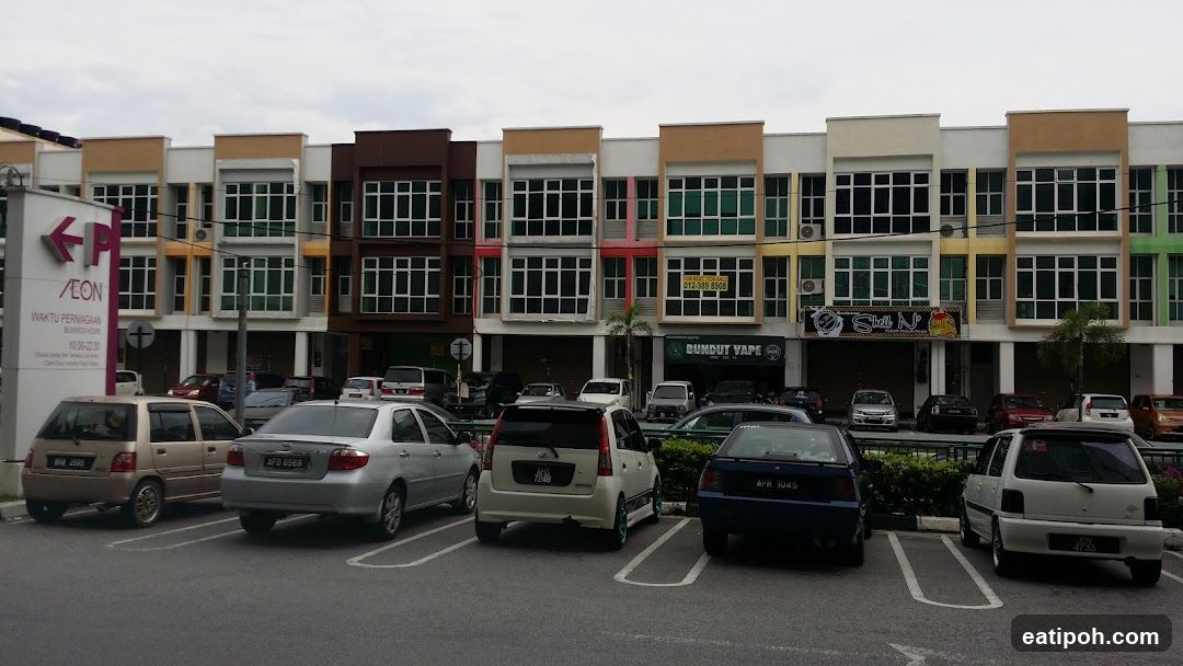 Commercial building facade with parking lot