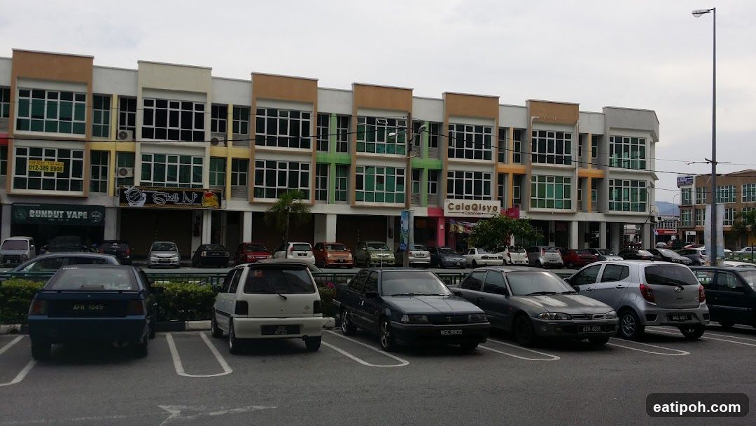 Commercial building facade with parked cars