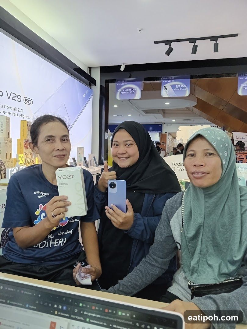 Three women in phone store