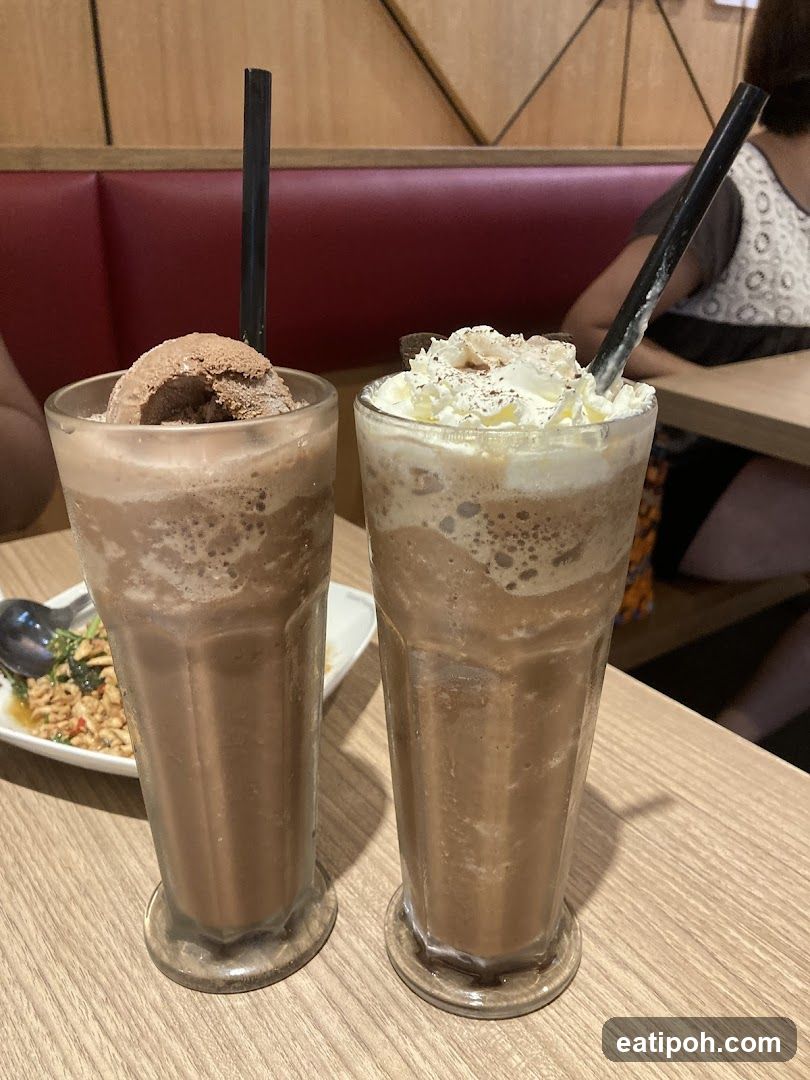 Two Chocolate Milkshakes on Table