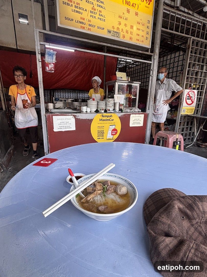 Street food stall with customers and staff