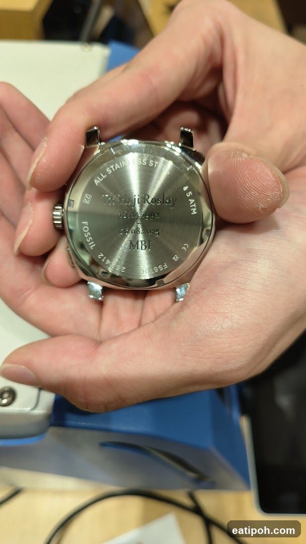 Hand holding watch case