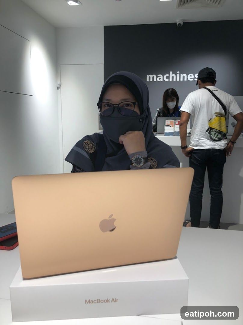 Woman with Laptop in Electronics Store