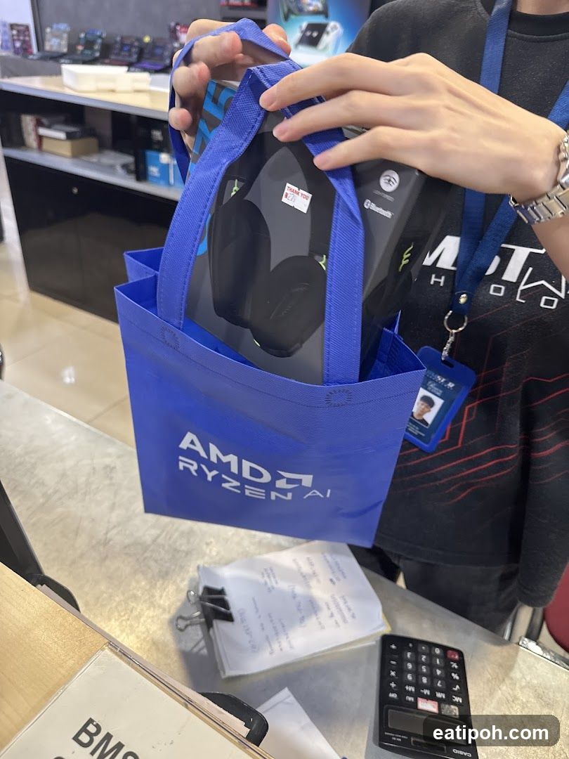 Customer with Headphones in AMD Bag