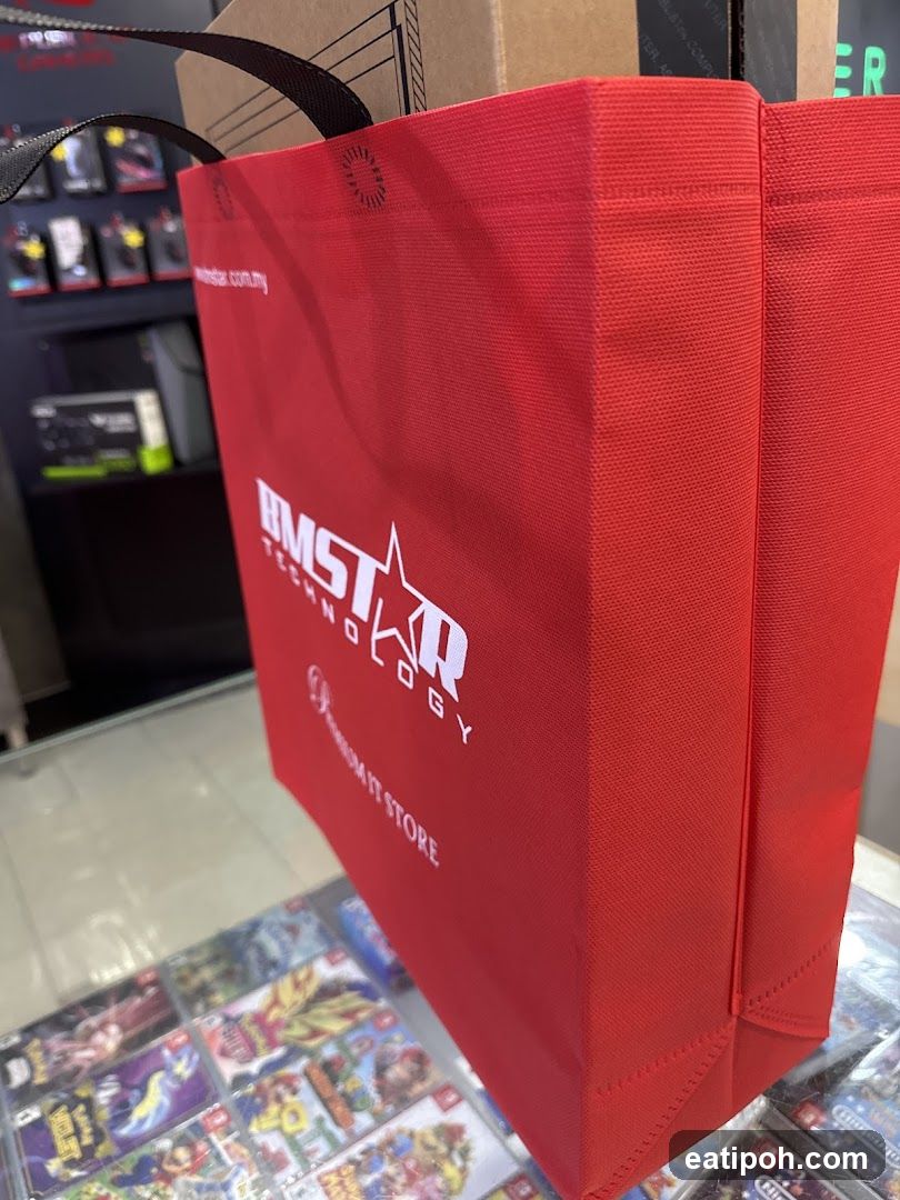 Red shopping bag with company logo