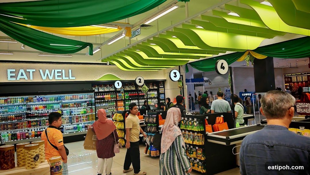 Supermarket Interior with "Eat Well" Signage