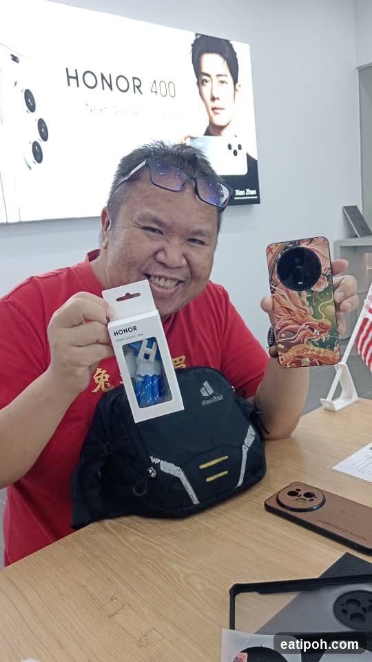 Man holding Honor 400 accessories