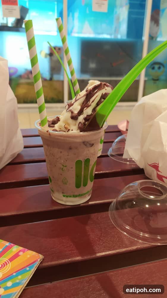 Chocolate milkshake with whipped cream and chocolate drizzle