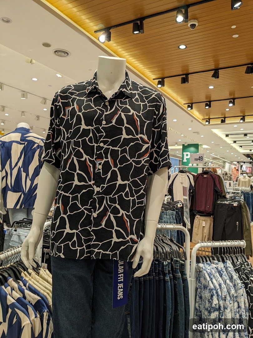 Mannequin wearing patterned shirt and jeans