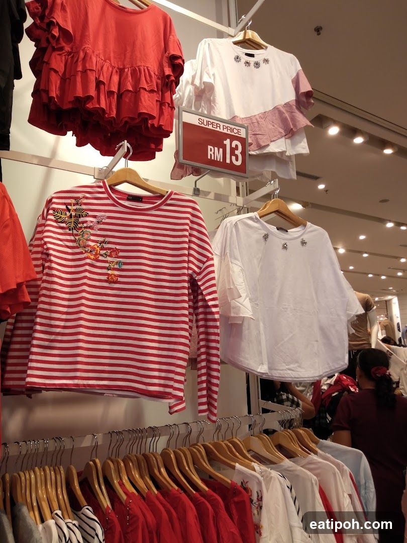 Clothing display with sale sign