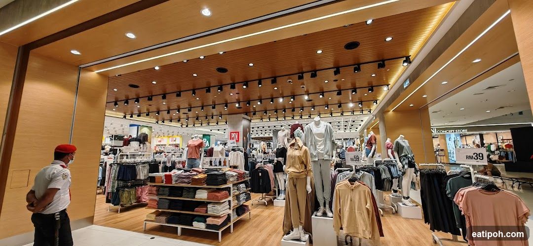 Clothing store interior with mannequins and clothing racks