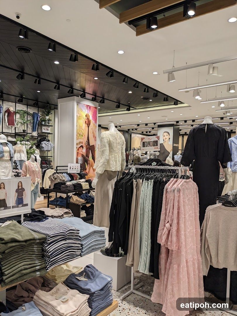 Clothing store interior with mannequins and apparel