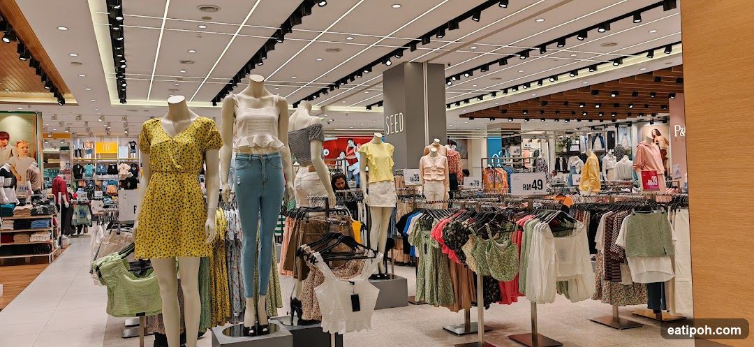 Clothing store interior with mannequins and racks of clothes