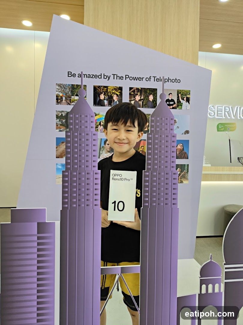 Boy Holding OPPO Reno10 Pro 5G Box