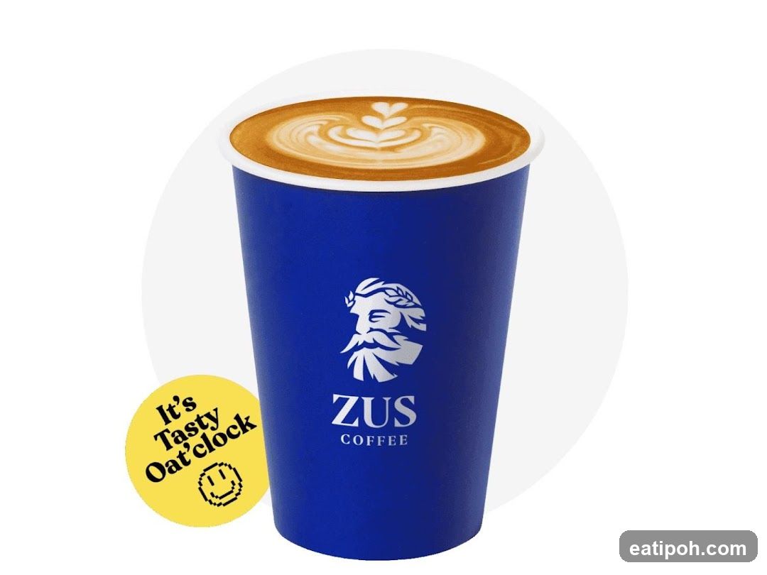 Latte with ZUS Coffee logo