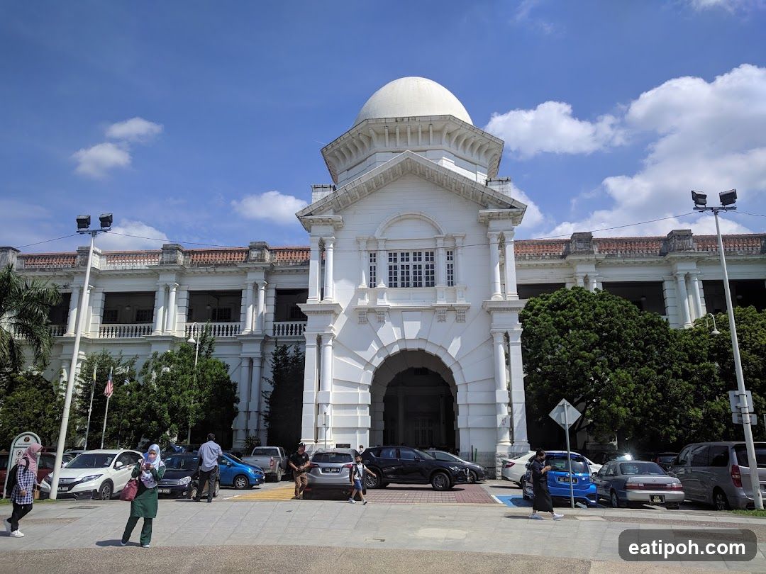 White Building with Dome and Arched Entrance