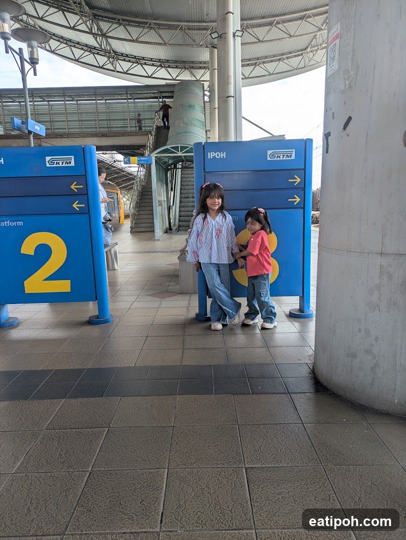Two girls at a train station