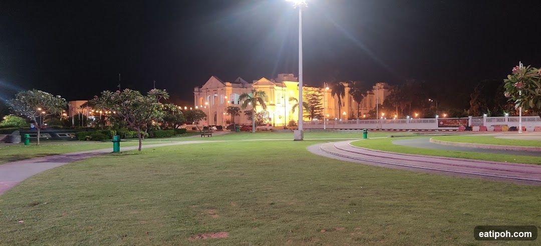 Night View of a Large Illuminated Building and Park