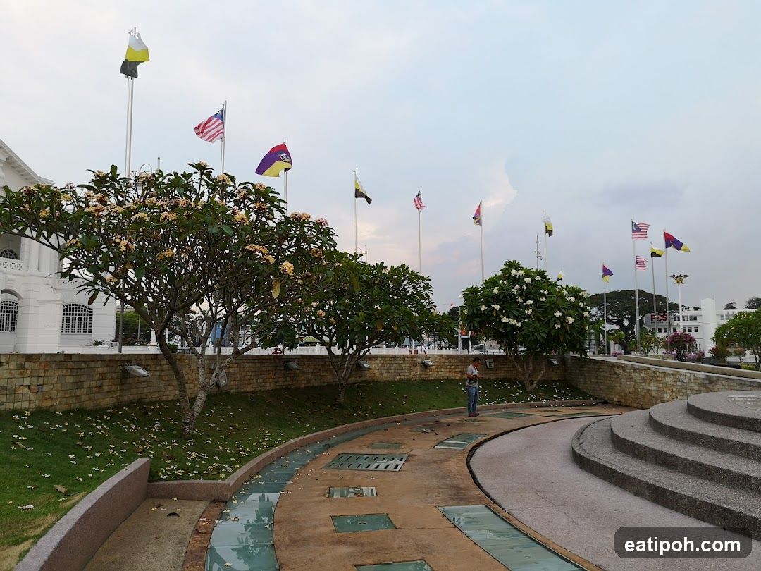 Outdoor Plaza with Flags and Trees