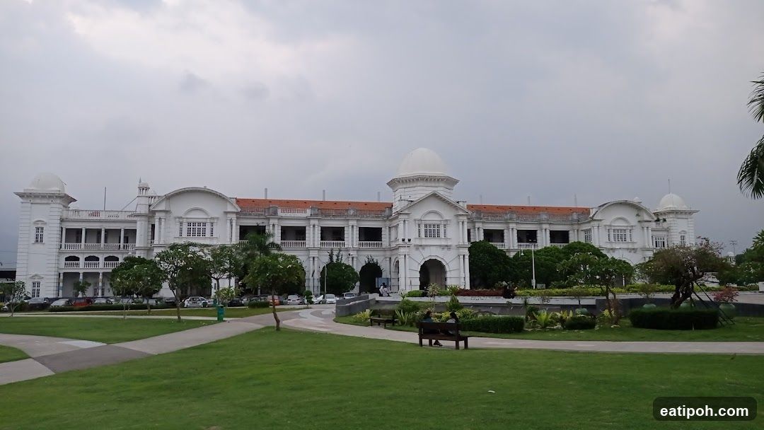 Grand White Building with Green Lawns