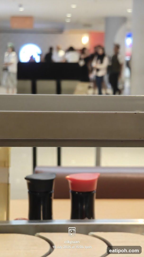 Condiment Bottles on Conveyor Belt