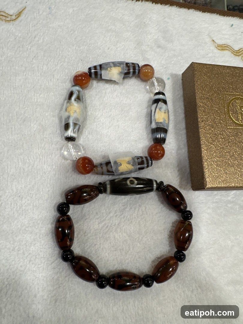 Two bracelets with dzi beads