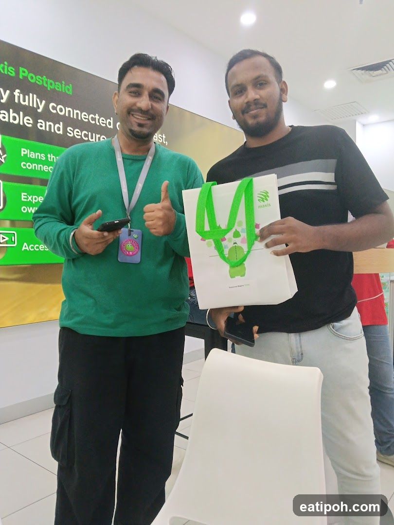 Two men posing with a shopping bag