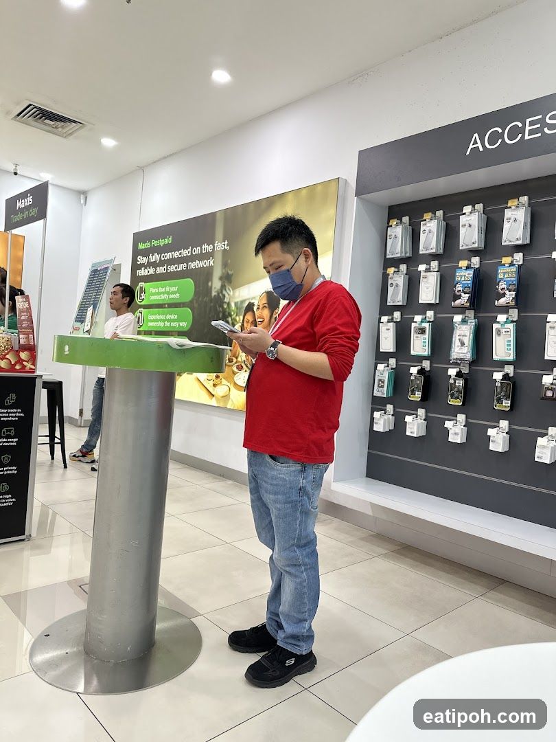 Man using phone in a store