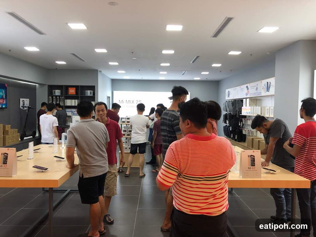 People browsing electronics in a store