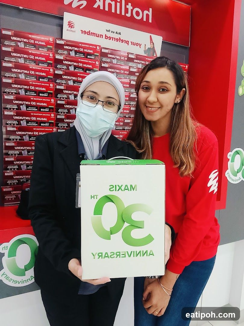 Two women holding a box